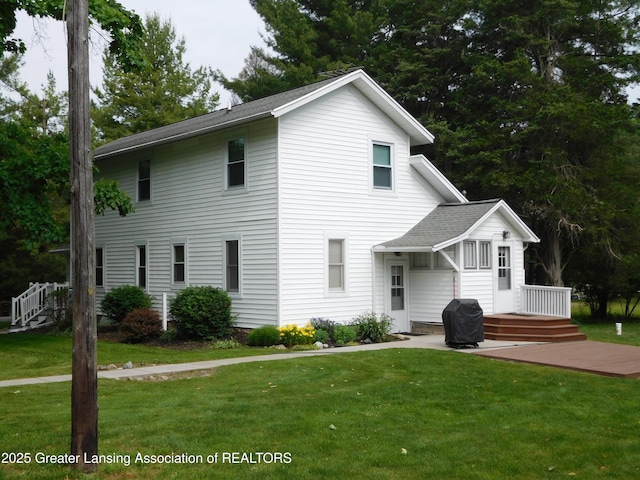 2229 Ives Rd, Leslie, MI 49251 - view of front facade with a front lawn and roof with shingles