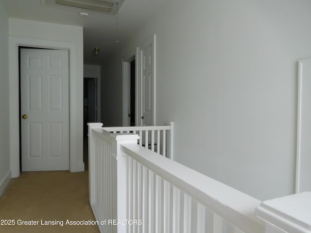 2229 Ives Rd, Leslie, MI 49251 - hallway featuring an upstairs landing and light colored carpet