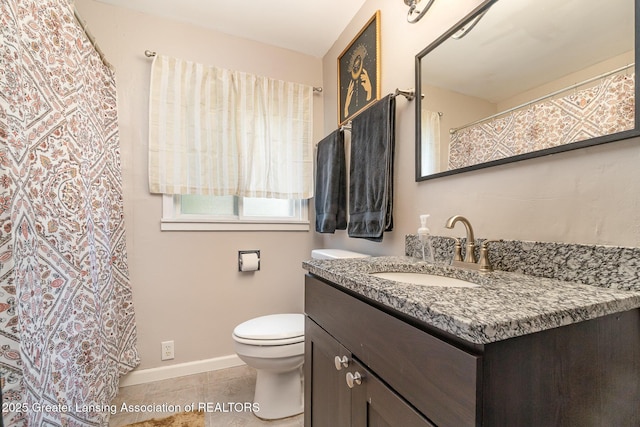 504 Iowa St, Alma, MI 48801 - full bath with vanity, toilet, tile patterned flooring, and baseboards