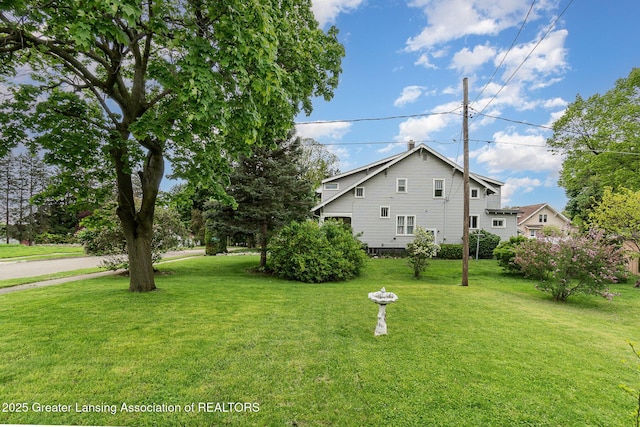 504 Iowa St, Alma, MI 48801 - view of side of home with a lawn