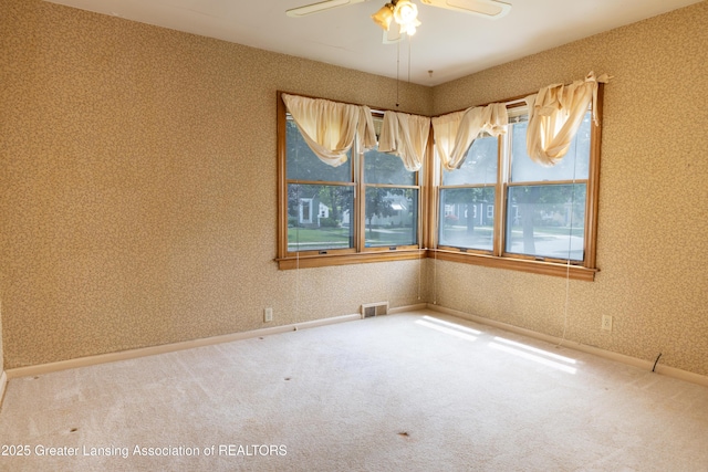 1720 Quentin Ave, Lansing, MI 48910 - unfurnished room with carpet flooring, a ceiling fan, and wallpapered walls
