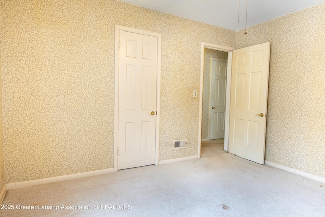 1720 Quentin Ave, Lansing, MI 48910 - unfurnished bedroom featuring carpet flooring, wallpapered walls, and baseboards