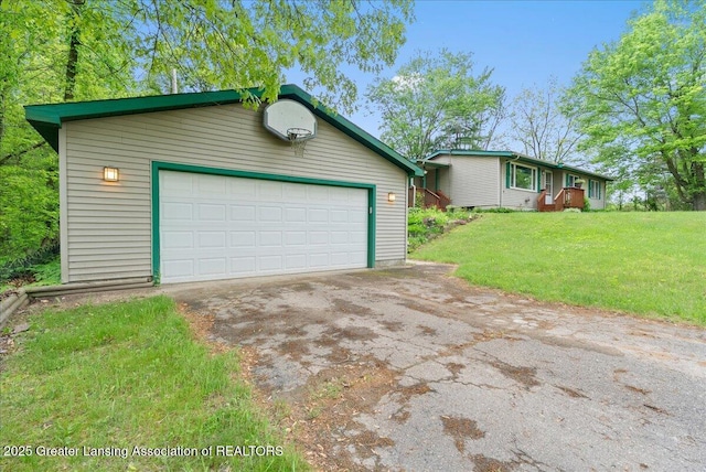 8279 Tyrrell Rd, Laingsburg, MI 48848 - view of front of property featuring a garage, driveway, a front yard, and an outdoor structure