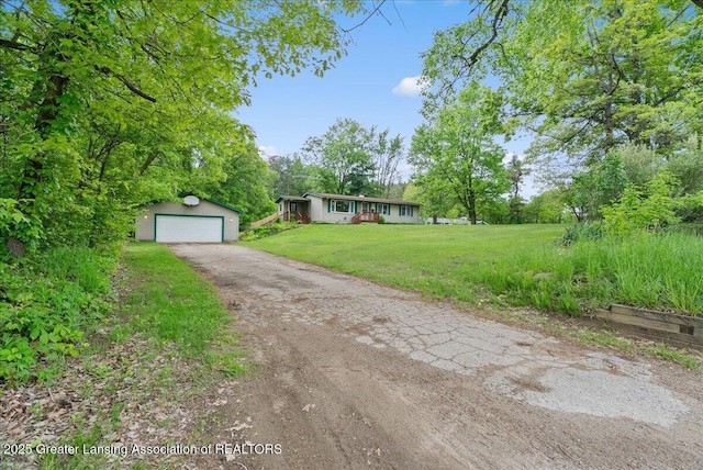 8279 Tyrrell Rd, Laingsburg, MI 48848 - view of front of property featuring an outbuilding, a front yard, and a detached garage