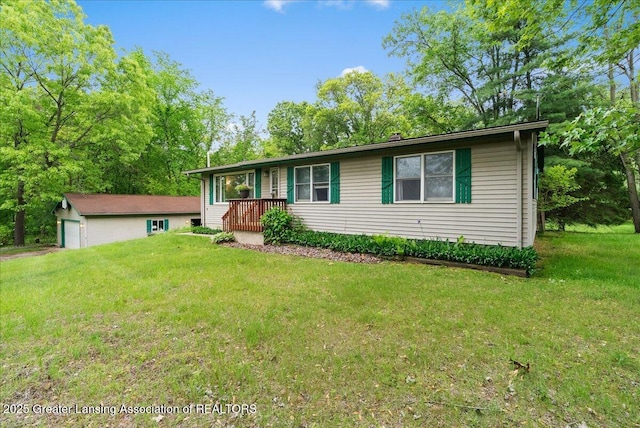 8279 Tyrrell Rd, Laingsburg, MI 48848 - view of front facade with a front lawn and a garage