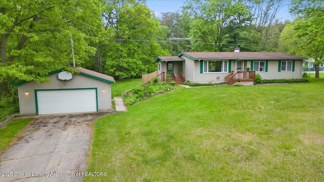 8279 Tyrrell Rd, Laingsburg, MI 48848 - ranch-style house with an outbuilding, a detached garage, and a front yard