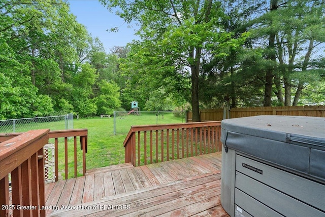 8279 Tyrrell Rd, Laingsburg, MI 48848 - wooden deck with a hot tub and a playground