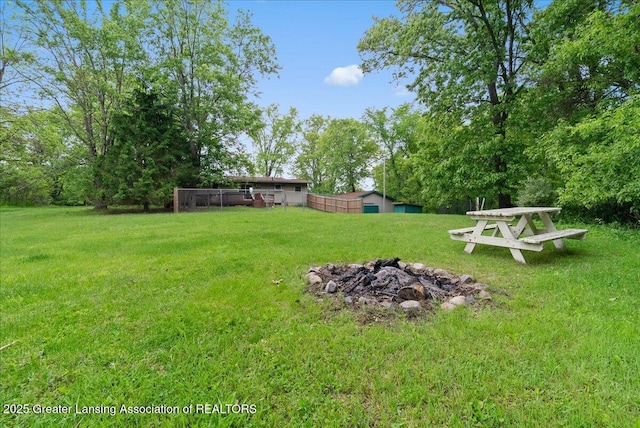 8279 Tyrrell Rd, Laingsburg, MI 48848 - view of grassy yard featuring a fire pit