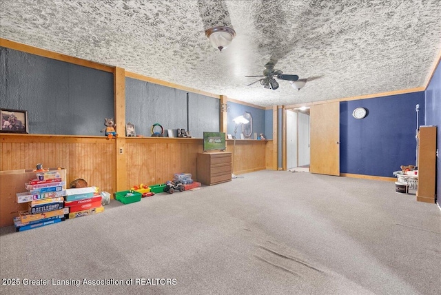 8279 Tyrrell Rd, Laingsburg, MI 48848 - rec room with a ceiling fan, carpet floors, and wooden walls