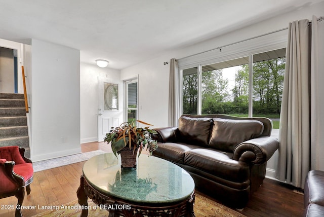 6415 Creyts Rd, Dimondale, MI 48821 - living area featuring hardwood / wood-style flooring, stairs, and baseboards