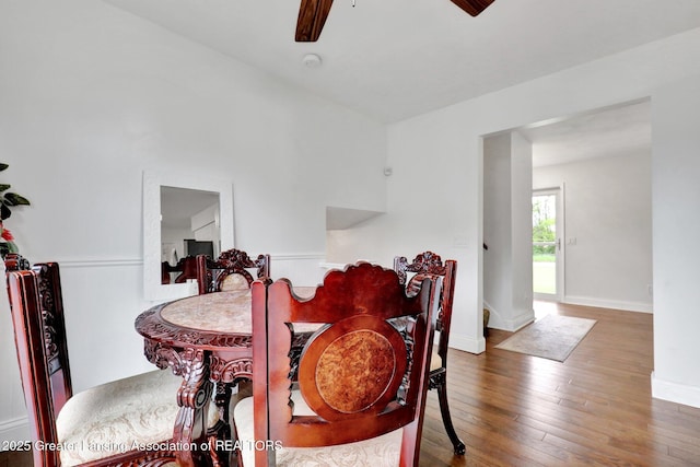 6415 Creyts Rd, Dimondale, MI 48821 - dining area featuring ceiling fan, hardwood / wood-style floors, and baseboards