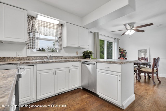 6415 Creyts Rd, Dimondale, MI 48821 - kitchen with stainless steel dishwasher, a sink, electric stove, and dark wood-type flooring