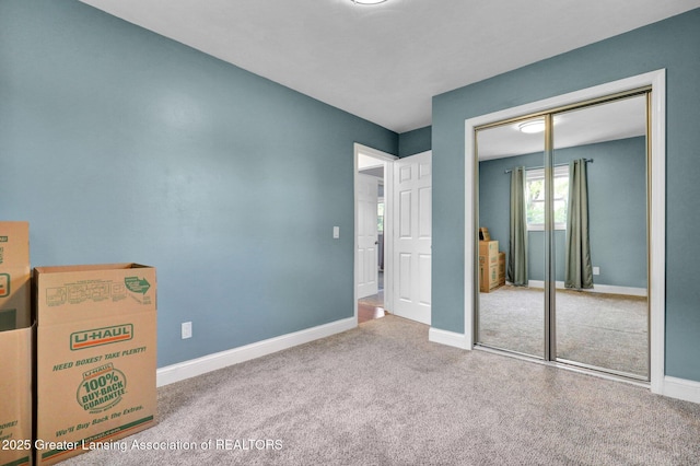 6415 Creyts Rd, Dimondale, MI 48821 - unfurnished bedroom featuring carpet flooring, baseboards, and a closet