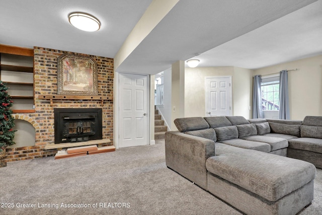 6415 Creyts Rd, Dimondale, MI 48821 - carpeted living area with stairs and a brick fireplace