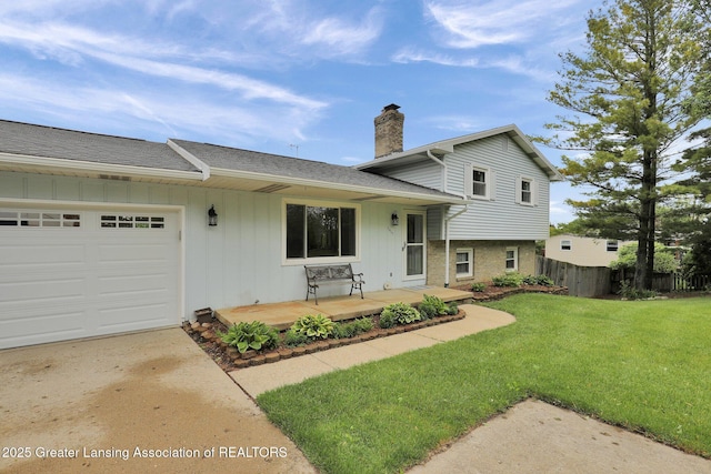 6415 Creyts Rd, Dimondale, MI 48821 - view of front of house with a chimney, board and batten siding, a garage, a shingled roof, and concrete driveway