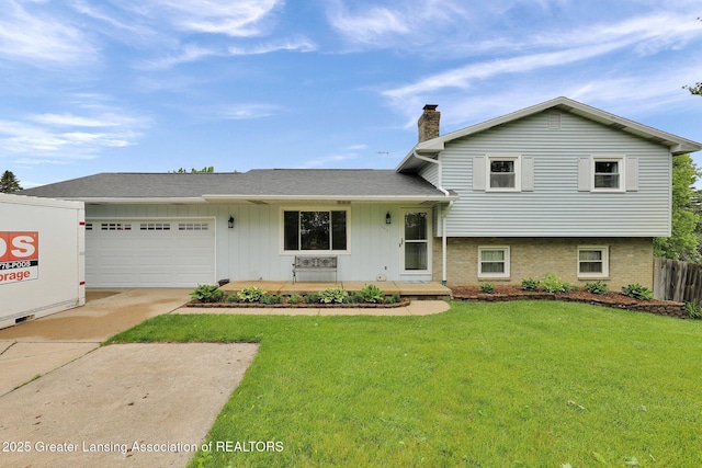6415 Creyts Rd, Dimondale, MI 48821 - split level home featuring driveway, a chimney, an attached garage, and brick siding