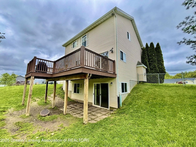 405 N Iris Ln, Laingsburg, MI 48848 - rear view of house featuring a lawn, a deck, and a patio area