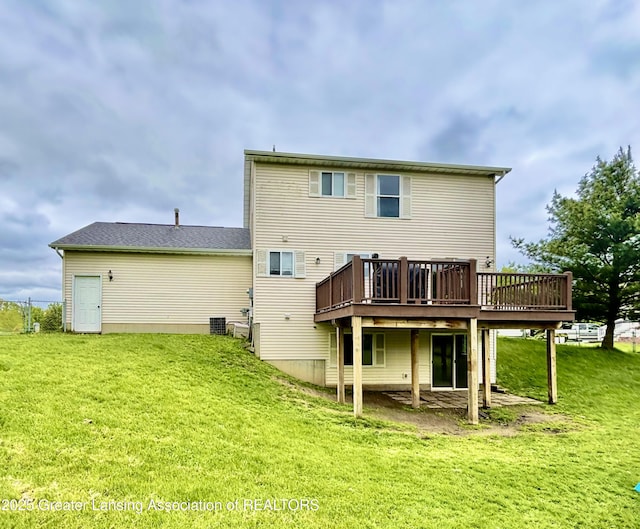 405 N Iris Ln, Laingsburg, MI 48848 - rear view of property with a wooden deck, a lawn, and central AC unit