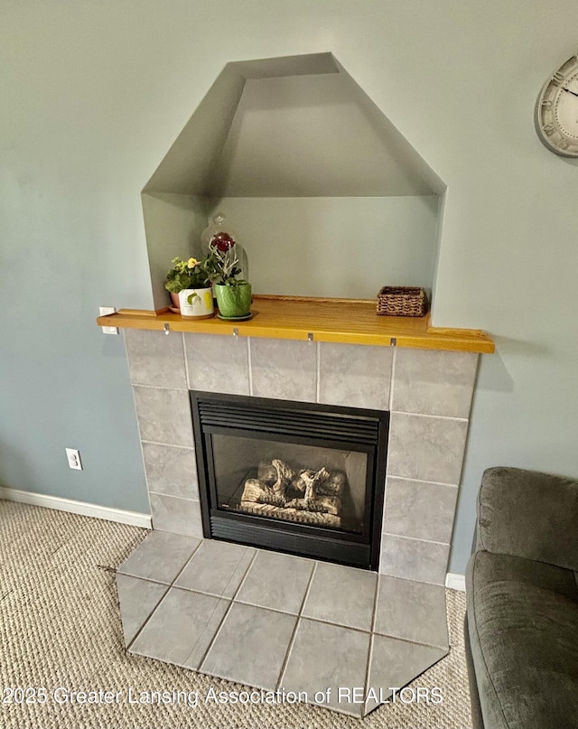 405 N Iris Ln, Laingsburg, MI 48848 - detailed view of a fireplace, baseboards, and carpet floors