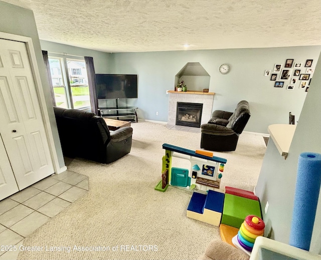 405 N Iris Ln, Laingsburg, MI 48848 - living room featuring carpet flooring, a textured ceiling, a tile fireplace, and baseboards
