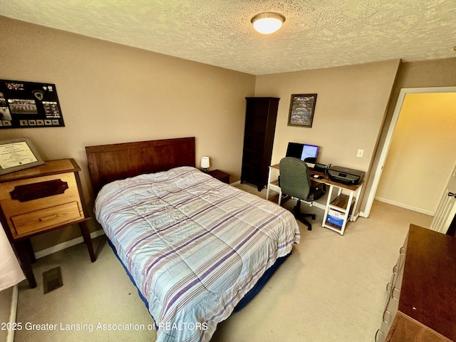 405 N Iris Ln, Laingsburg, MI 48848 - carpeted bedroom with a textured ceiling and baseboards