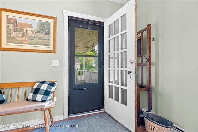 218 Russell St, Grand Ledge, MI 48837 - doorway to outside with baseboard heating