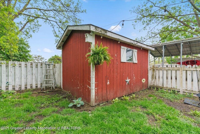 218 Russell St, Grand Ledge, MI 48837 - view of shed featuring a fenced backyard
