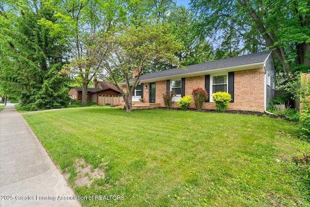 420 John R St, East Lansing, MI 48823 - view of front of house featuring brick siding and a front yard