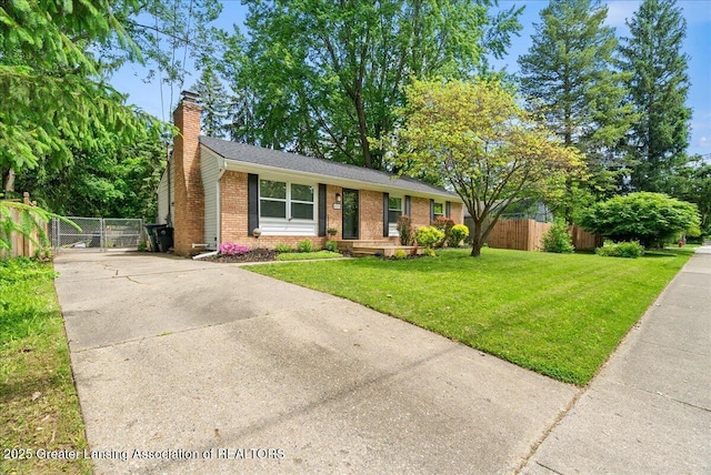 420 John R St, East Lansing, MI 48823 - view of front of home with a gate, a chimney, brick siding, and concrete driveway