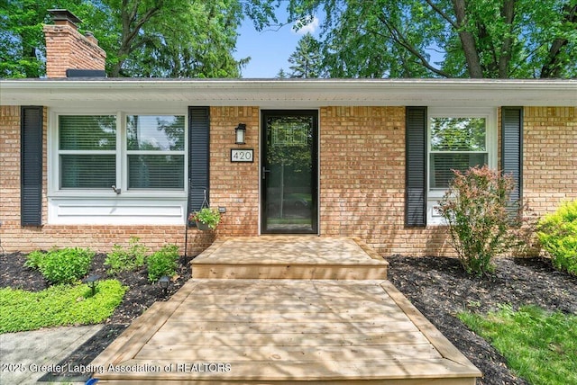 420 John R St, East Lansing, MI 48823 - property entrance with brick siding and a chimney