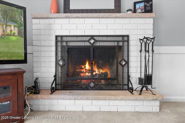 420 John R St, East Lansing, MI 48823 - detailed view of a brick fireplace and carpet floors