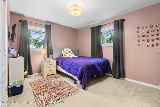 420 John R St, East Lansing, MI 48823 - bedroom featuring multiple windows, carpet flooring, and baseboards