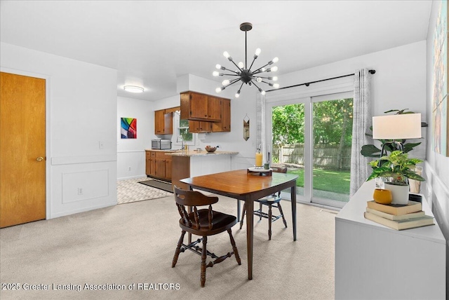 420 John R St, East Lansing, MI 48823 - dining space featuring a chandelier and light carpet