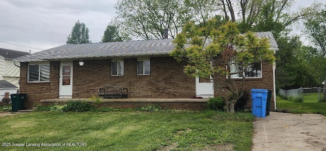 6622 Aurelius Rd, Lansing, MI 48911 - view of front of house featuring brick siding and roof with shingles