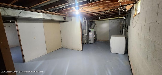 6622 Aurelius Rd, Lansing, MI 48911 - unfinished basement with water heater, washer / dryer, and concrete block wall