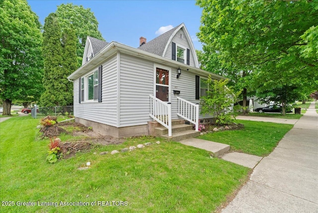 407 Kearney St, Portland, MI 48875 - view of front of house with roof with shingles and a chimney