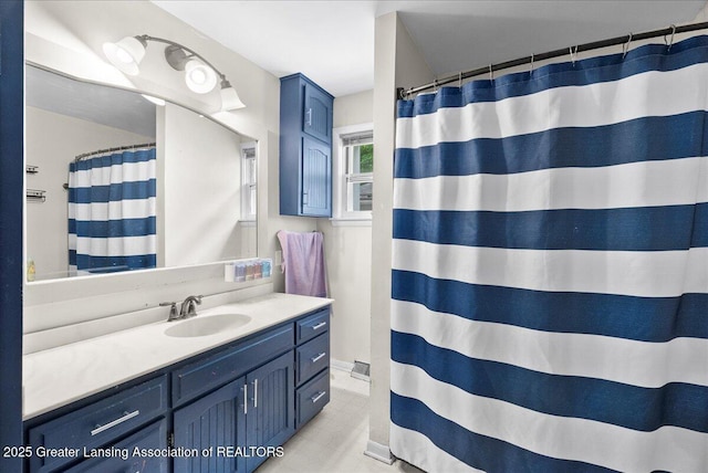 407 Kearney St, Portland, MI 48875 - bathroom featuring vanity, a shower with shower curtain, and tile patterned floors