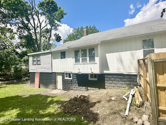 218 S Hayford Ave, Lansing, MI 48912 - back of property with a chimney and a yard