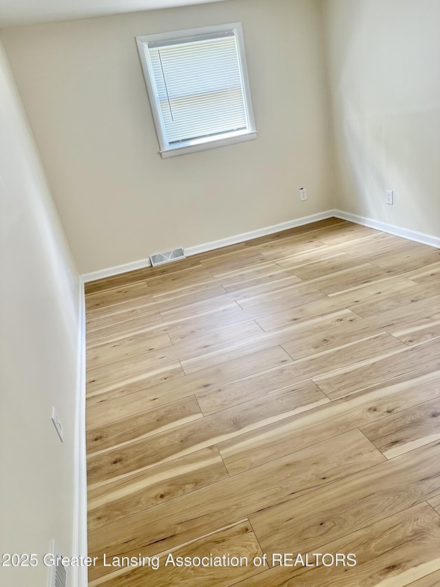 218 S Hayford Ave, Lansing, MI 48912 - unfurnished room featuring wood finished floors and baseboards