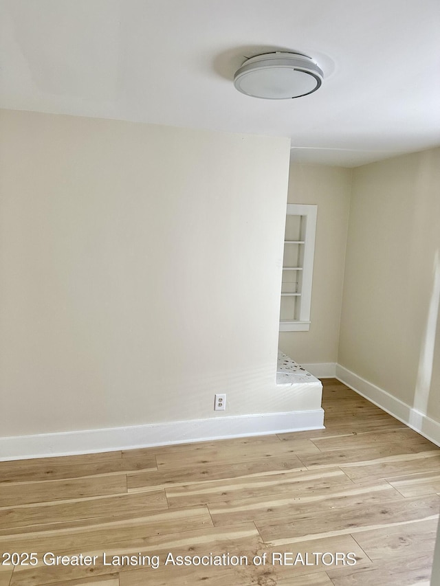 218 S Hayford Ave, Lansing, MI 48912 - spare room with baseboards and wood finished floors