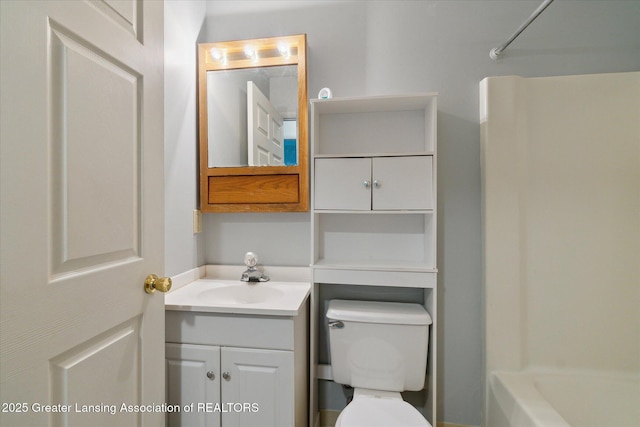 820 Kenwood Ave, Lansing, MI 48910 - bathroom with vanity, toilet, and  shower combination