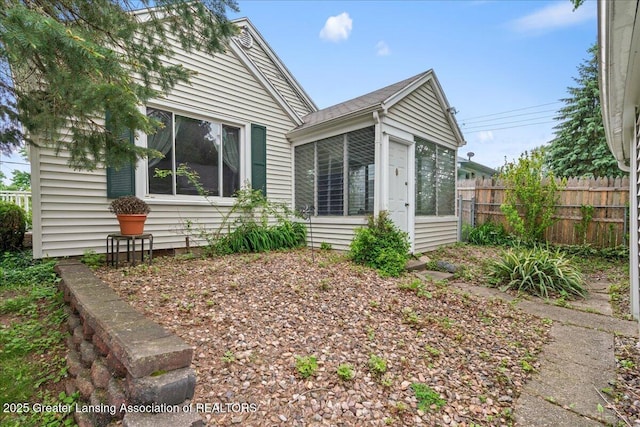 1218 Woodbine Ave, Lansing, MI 48910 - view of home's exterior featuring a sunroom