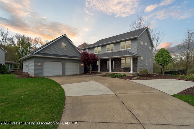 549 Riverwalk Dr, Mason, MI 48854 - traditional home featuring driveway, covered porch, and a shingled roof