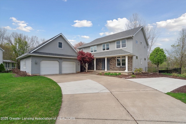 549 Riverwalk Dr, Mason, MI 48854 - traditional-style house with driveway, a porch, a garage, and roof with shingles