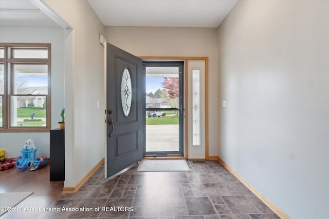549 Riverwalk Dr, Mason, MI 48854 - foyer entrance featuring baseboards