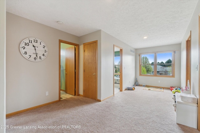 549 Riverwalk Dr, Mason, MI 48854 - carpeted spare room with baseboards, a textured ceiling, and a smoke detector