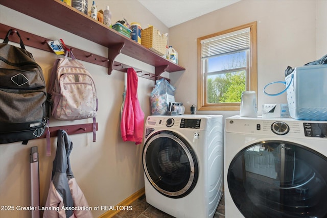 549 Riverwalk Dr, Mason, MI 48854 - laundry area featuring washing machine and clothes dryer and baseboards