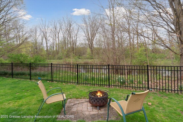 549 Riverwalk Dr, Mason, MI 48854 - view of yard with a fire pit