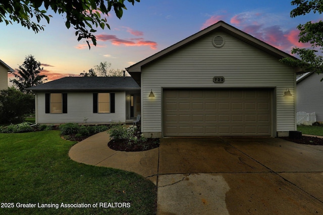 722 Fieldview Dr, Grand Ledge, MI 48837 - ranch-style house with a front lawn, an attached garage, and concrete driveway