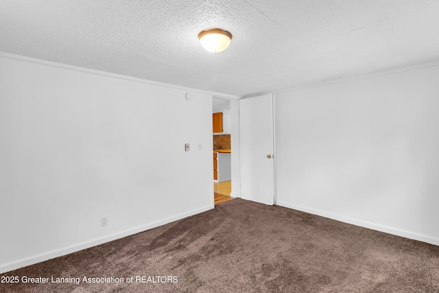 316 S Rosemary Ave, Lansing, MI 48917 - carpeted empty room featuring a textured ceiling and baseboards